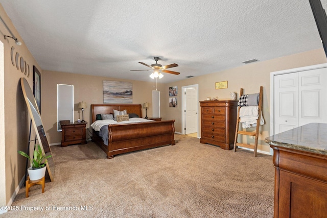 12371 Glen Haven St, Spring Hill, FL 34609 - bedroom with light carpet, baseboards, a textured ceiling, and a ceiling fan