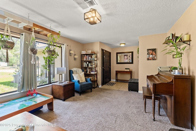 12371 Glen Haven St, Spring Hill, FL 34609 - sitting room with carpet flooring, a textured ceiling, and baseboards