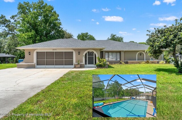 12371 Glen Haven St, Spring Hill, FL 34609 - view of front of home featuring stucco siding, a front yard, an attached garage, driveway, and roof with shingles