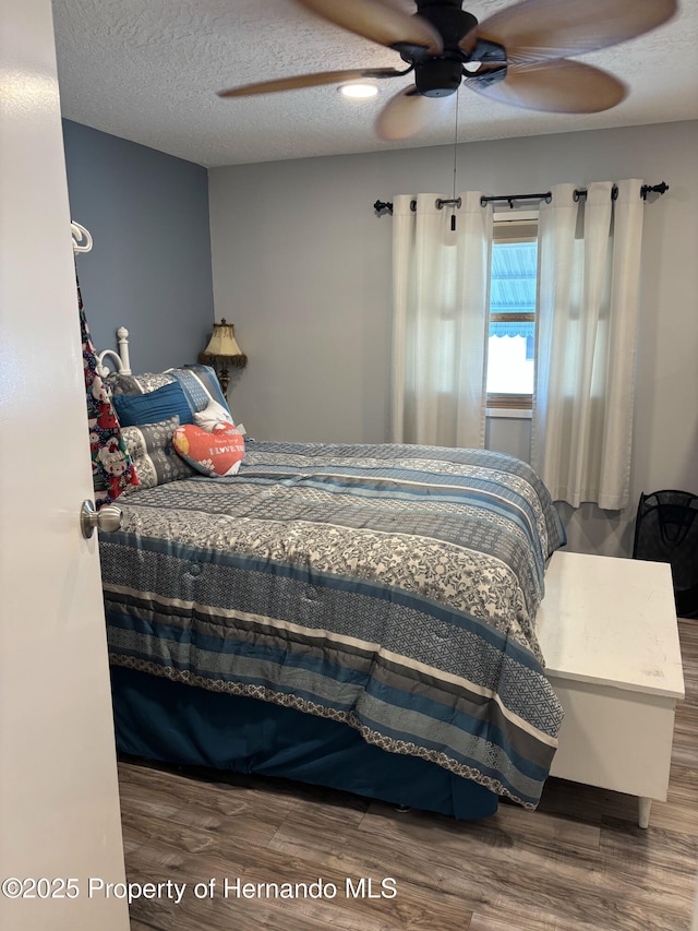 15693 Brookridge Blvd, Brooksville, FL 34613 - bedroom featuring wood finished floors and a ceiling fan