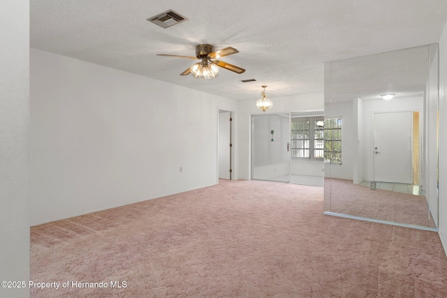 10820 Hachita Dr, Port Richey, FL 34668 - carpeted empty room with ceiling fan and a chandelier