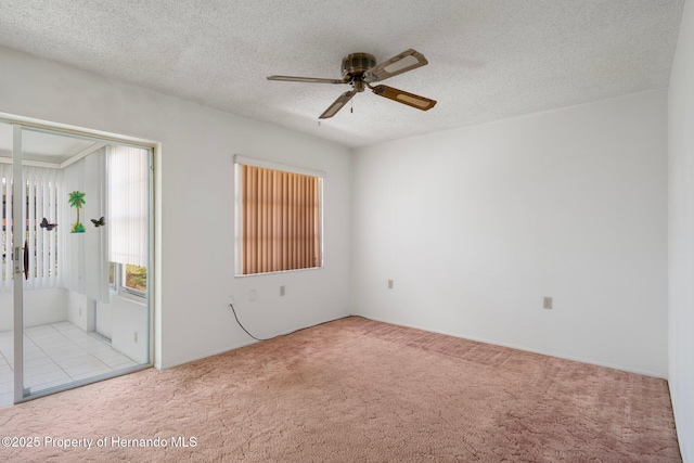10820 Hachita Dr, Port Richey, FL 34668 - unfurnished bedroom with carpet, access to outside, ceiling fan, and a textured ceiling