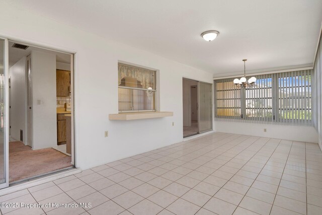 10820 Hachita Dr, Port Richey, FL 34668 - unfurnished room featuring a chandelier