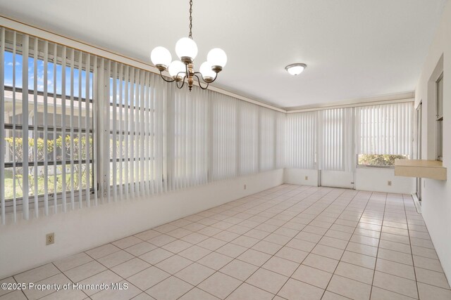 10820 Hachita Dr, Port Richey, FL 34668 - unfurnished sunroom featuring a chandelier