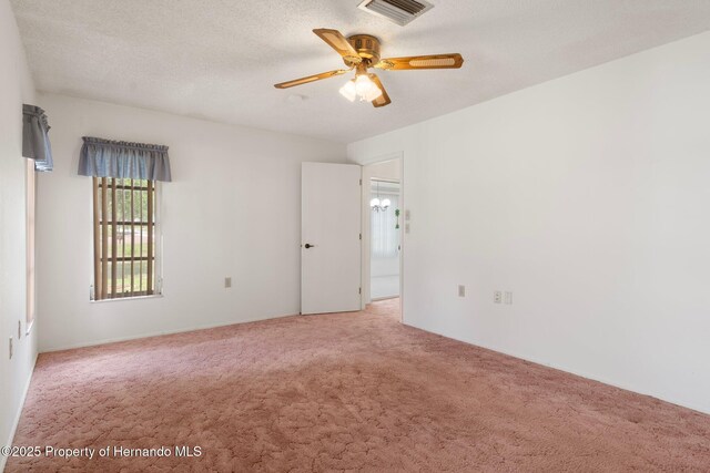 10820 Hachita Dr, Port Richey, FL 34668 - spare room featuring light carpet and a ceiling fan