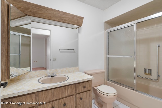10820 Hachita Dr, Port Richey, FL 34668 - bathroom featuring toilet, vanity, and bath / shower combo with glass door