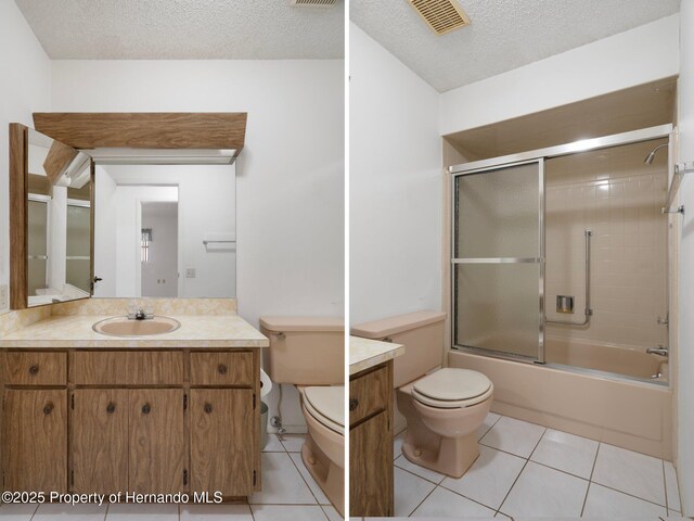 10820 Hachita Dr, Port Richey, FL 34668 - bathroom with toilet, tile patterned floors, a textured ceiling, vanity, and enclosed tub / shower combo