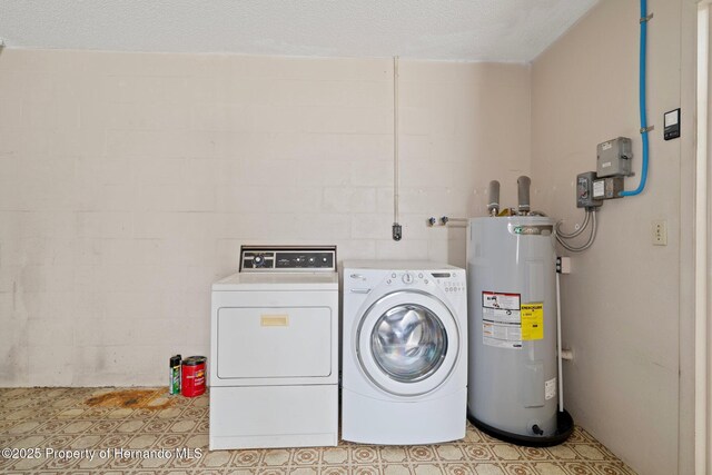 10820 Hachita Dr, Port Richey, FL 34668 - laundry room with water heater and washing machine and dryer