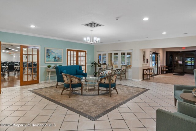 10820 Hachita Dr, Port Richey, FL 34668 - dining room featuring french doors, light tile patterned flooring, crown molding, recessed lighting, and a chandelier
