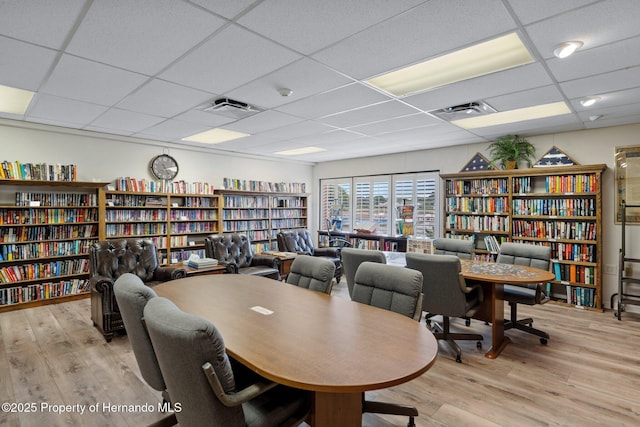 10820 Hachita Dr, Port Richey, FL 34668 - office with bookshelves, wood finished floors, and a paneled ceiling