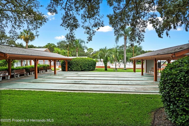 10820 Hachita Dr, Port Richey, FL 34668 - view of home's community with a yard and shuffleboard