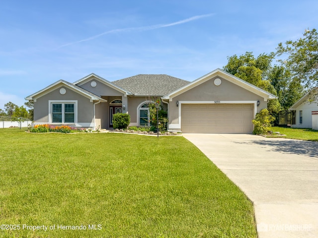 3095 Coronet Ct, Spring Hill, FL 34609 - view of front facade with stucco siding, a garage, a front yard, and concrete driveway