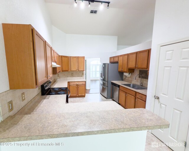 3095 Coronet Ct, Spring Hill, FL 34609 - kitchen with electric stove, a sink, stainless steel dishwasher, light countertops, and lofted ceiling