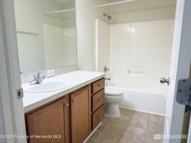 3095 Coronet Ct, Spring Hill, FL 34609 - bathroom featuring toilet, vanity, and shower / washtub combination