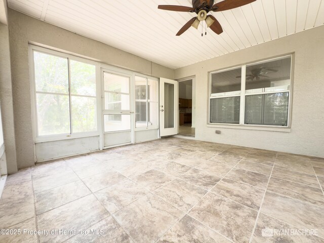 3095 Coronet Ct, Spring Hill, FL 34609 - unfurnished sunroom featuring a ceiling fan and healthy amount of natural light