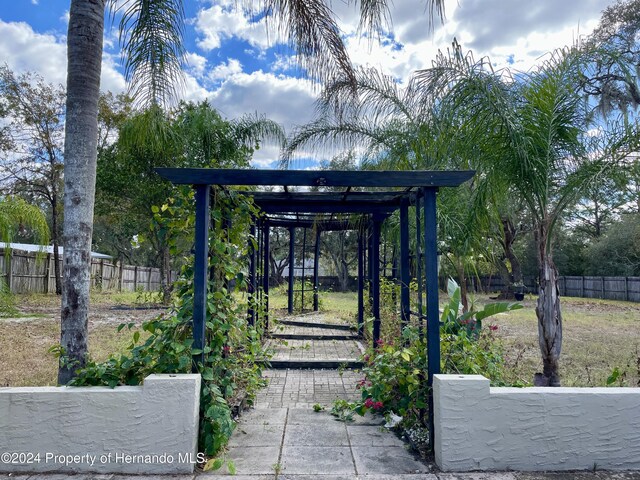 10448 Canary Ave, Weeki Wachee, FL 34613 - view of home's community with fence
