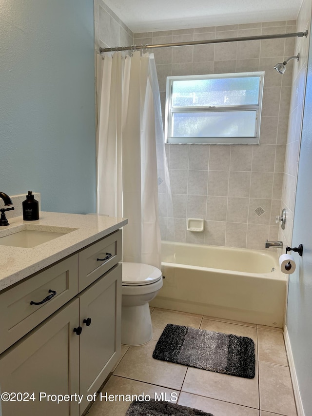 10448 Canary Ave, Weeki Wachee, FL 34613 - bathroom with tile patterned flooring, toilet, shower / bathtub combination with curtain, and vanity