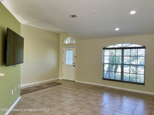 10448 Canary Ave, Weeki Wachee, FL 34613 - entryway with recessed lighting, baseboards, and light tile patterned flooring