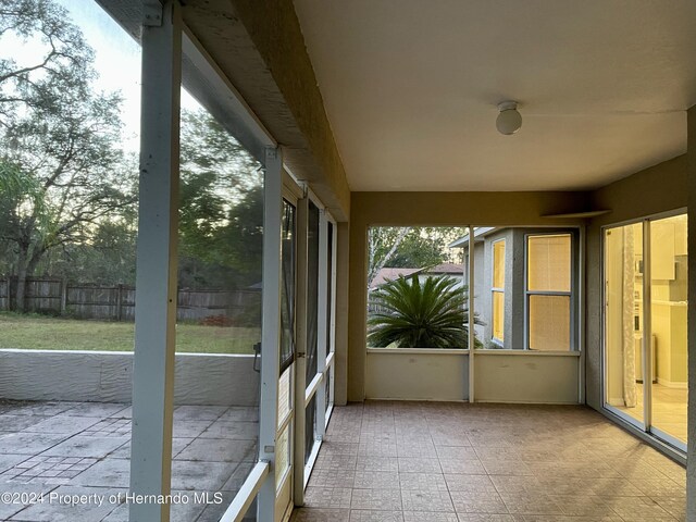 10448 Canary Ave, Weeki Wachee, FL 34613 - view of unfurnished sunroom