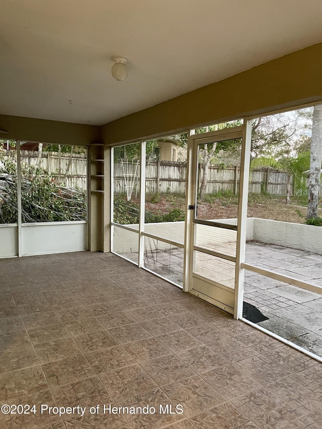 10448 Canary Ave, Weeki Wachee, FL 34613 - view of unfurnished sunroom