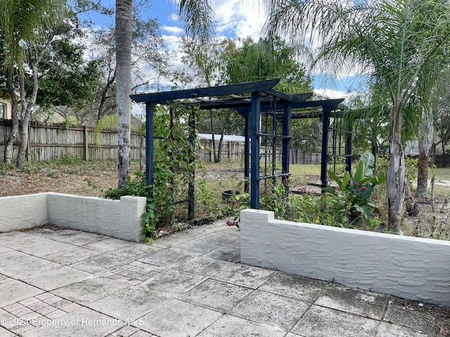 10448 Canary Ave, Weeki Wachee, FL 34613 - view of patio featuring a fenced backyard
