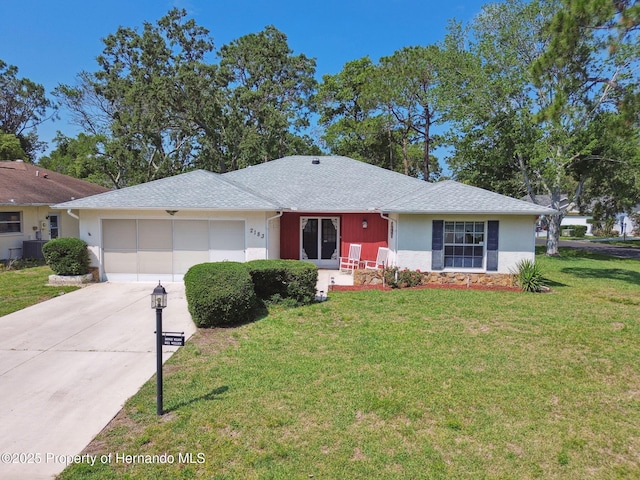 2183 Westchester Blvd, Spring Hill, FL 34606 - ranch-style house featuring a garage, driveway, a front yard, cooling unit, and stone siding
