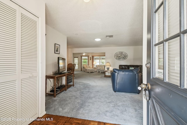 2183 Westchester Blvd, Spring Hill, FL 34606 - living room featuring carpet and a textured ceiling