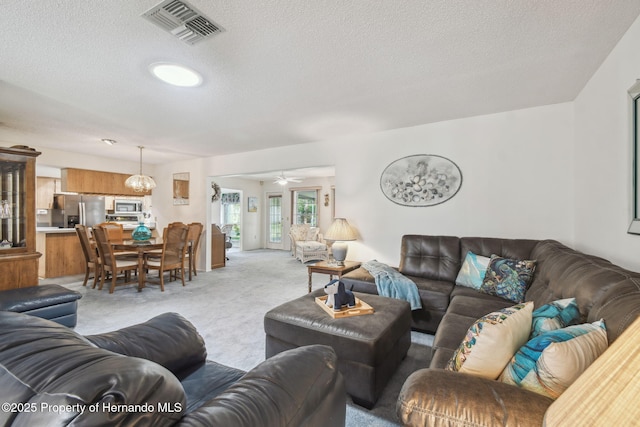2183 Westchester Blvd, Spring Hill, FL 34606 - living room featuring carpet floors, a textured ceiling, and a ceiling fan