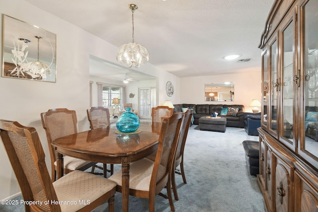 2183 Westchester Blvd, Spring Hill, FL 34606 - dining area with a chandelier, carpet floors, and ceiling fan
