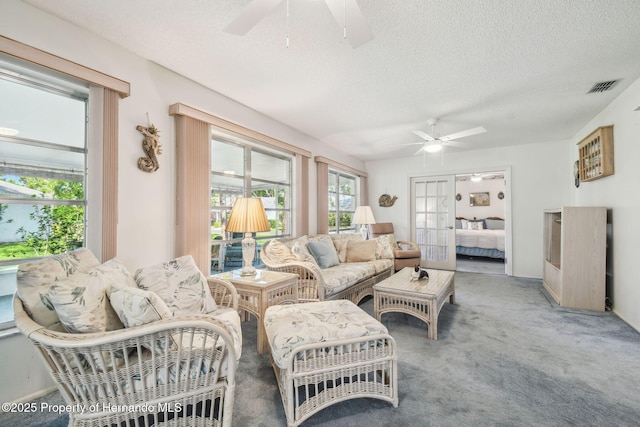 2183 Westchester Blvd, Spring Hill, FL 34606 - carpeted living room with a ceiling fan and a textured ceiling