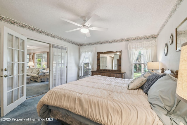 2183 Westchester Blvd, Spring Hill, FL 34606 - bedroom featuring french doors, a textured ceiling, carpet, and multiple windows