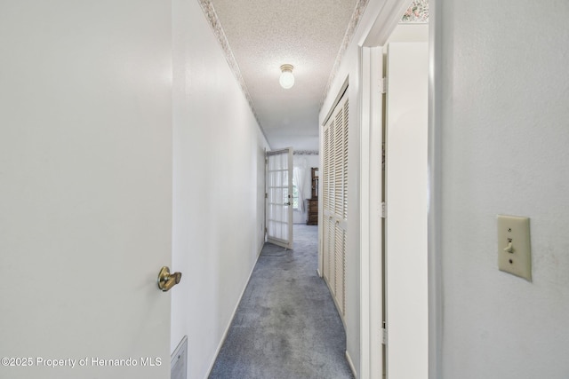2183 Westchester Blvd, Spring Hill, FL 34606 - hall featuring a textured ceiling and carpet floors