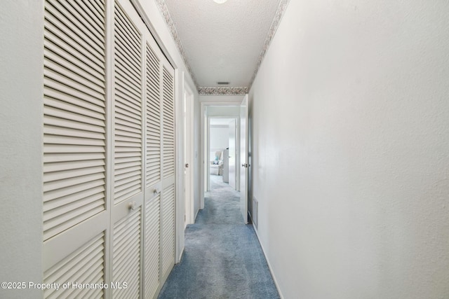 2183 Westchester Blvd, Spring Hill, FL 34606 - corridor with carpet and a textured ceiling