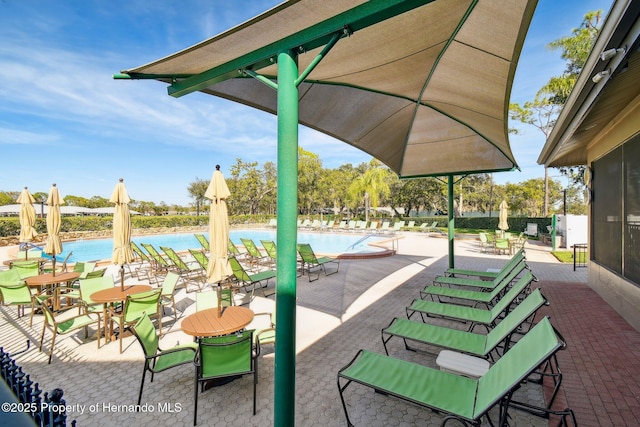 2183 Westchester Blvd, Spring Hill, FL 34606 - view of property's community with a swimming pool and a patio area