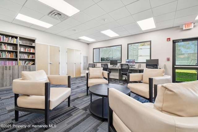 2183 Westchester Blvd, Spring Hill, FL 34606 - living area with a paneled ceiling, an office area, and dark colored carpet