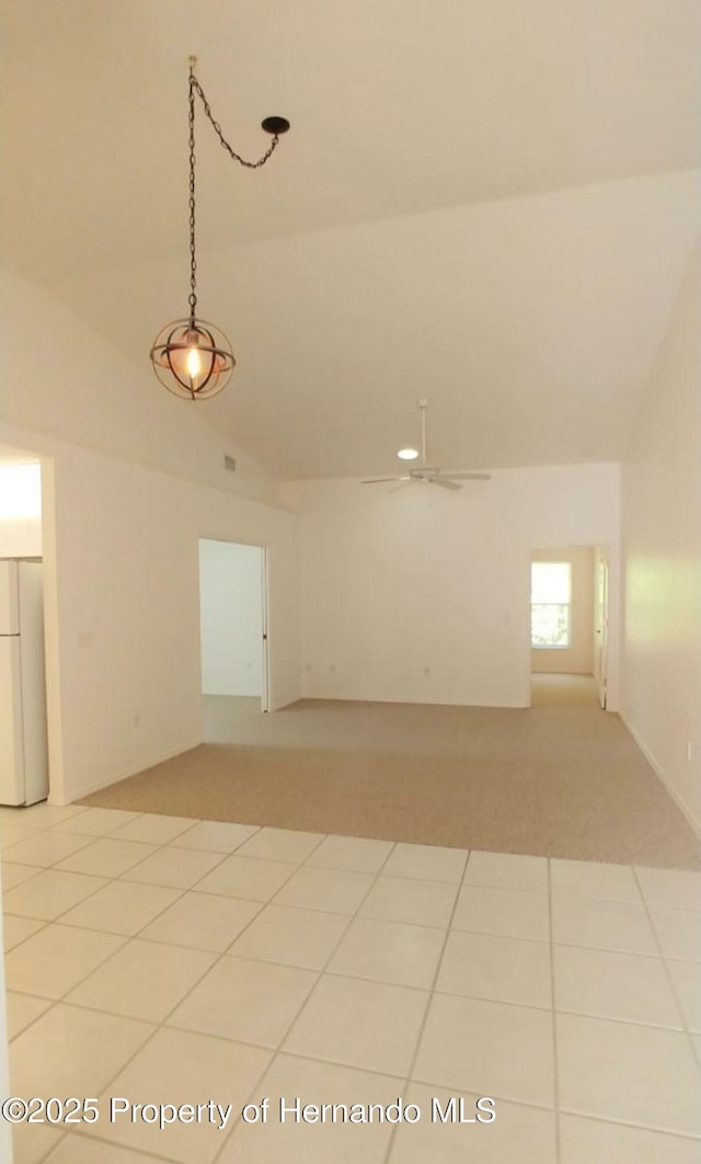 4035 Jason Rd, Spring Hill, FL 34608 - unfurnished room with a ceiling fan, high vaulted ceiling, and light colored carpet