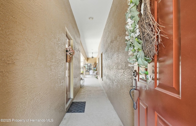 11752 Wheatfield Loop, Hudson, FL 34667 - hall featuring a textured wall