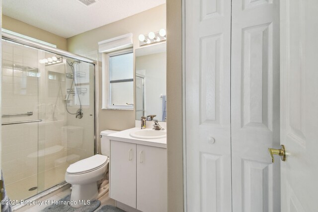11752 Wheatfield Loop, Hudson, FL 34667 - full bathroom with a shower stall, vanity, and toilet