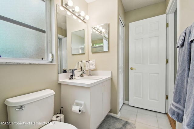 11752 Wheatfield Loop, Hudson, FL 34667 - bathroom featuring tile patterned floors, toilet, and vanity