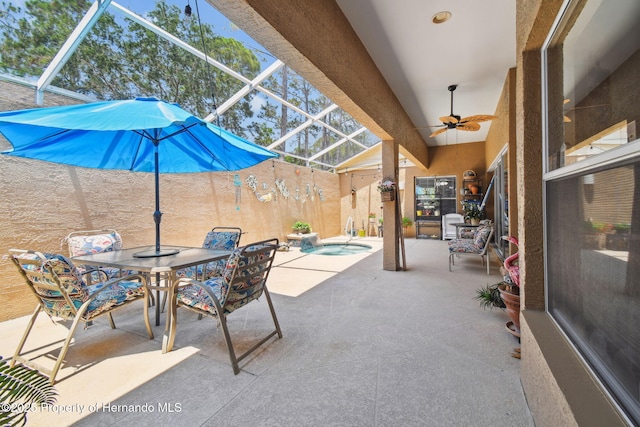 11752 Wheatfield Loop, Hudson, FL 34667 - view of patio / terrace with an in-ground hot tub, outdoor dining space, a lanai, and ceiling fan
