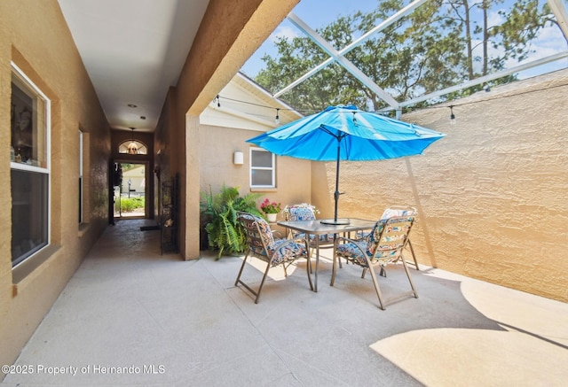 11752 Wheatfield Loop, Hudson, FL 34667 - view of patio / terrace with a lanai and outdoor dining space