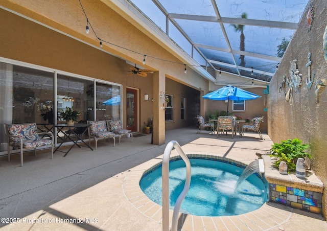 11752 Wheatfield Loop, Hudson, FL 34667 - outdoor pool featuring a patio, a jacuzzi, a ceiling fan, a lanai, and outdoor dining area