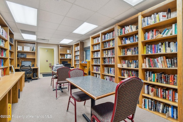 11752 Wheatfield Loop, Hudson, FL 34667 - carpeted office featuring wall of books and a drop ceiling