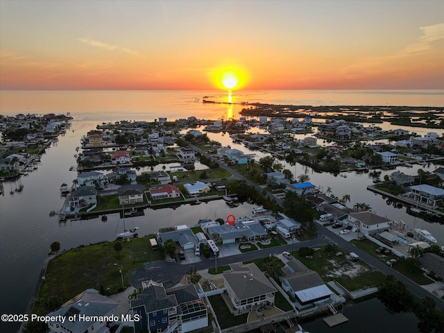 4387 6th Isle Dr, Hernando Beach, FL 34607 - aerial view at dusk of a water view and a residential view
