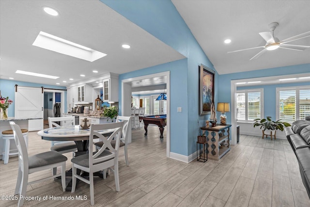 4387 6th Isle Dr, Hernando Beach, FL 34607 - dining area featuring light wood finished floors, billiards, a barn door, baseboards, and lofted ceiling