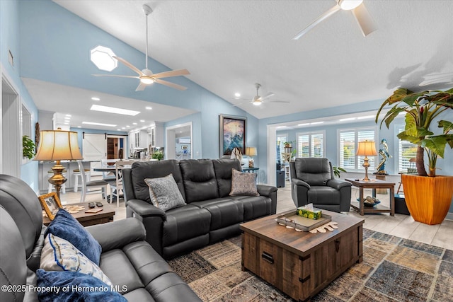 4387 6th Isle Dr, Hernando Beach, FL 34607 - living room featuring ceiling fan, lofted ceiling, a textured ceiling, and recessed lighting