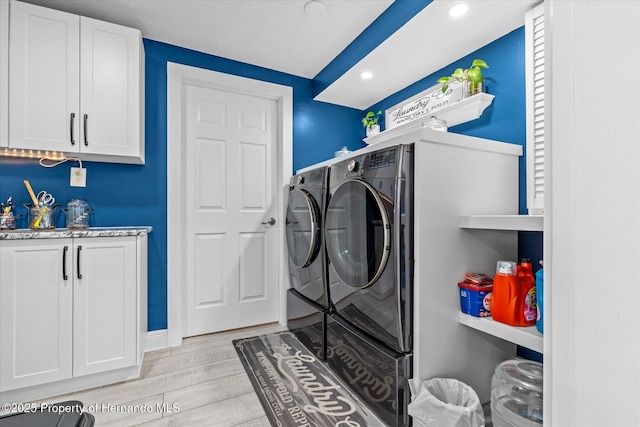 4387 6th Isle Dr, Hernando Beach, FL 34607 - washroom with washing machine and clothes dryer, light wood-style floors, and recessed lighting