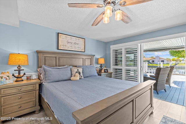 4387 6th Isle Dr, Hernando Beach, FL 34607 - bedroom with access to exterior, a textured ceiling, and ceiling fan
