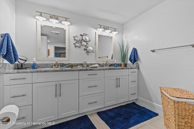 4387 6th Isle Dr, Hernando Beach, FL 34607 - full bath featuring double vanity and baseboards