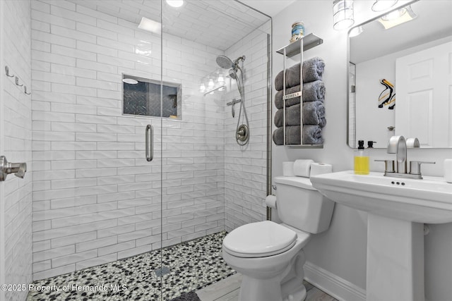 4387 6th Isle Dr, Hernando Beach, FL 34607 - bathroom with toilet, a shower stall, and a sink